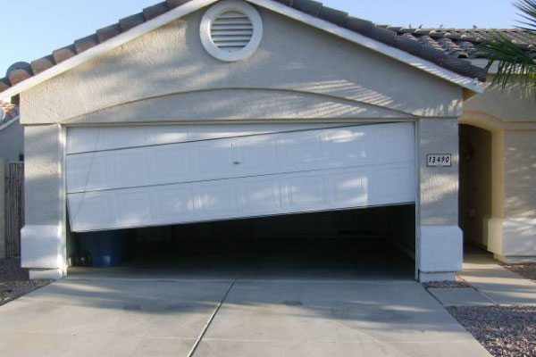 Tilted broken overhead door